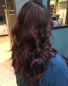 dark brown hair with red highlights