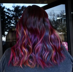 dark hair with red purple highlights