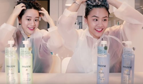 two girls washing their hair