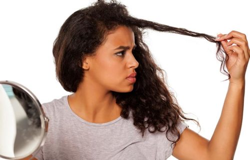 girl holding her hair